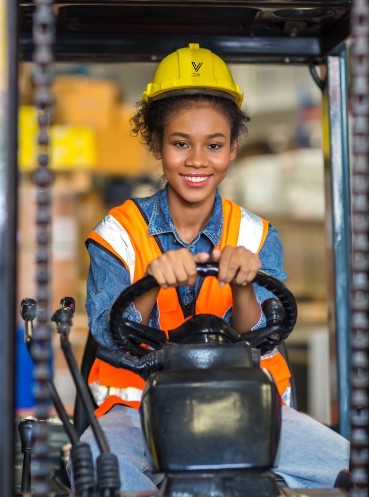 women-worker-at-forklift-driver-happy-working-in-industry-factory-logistic-ship-